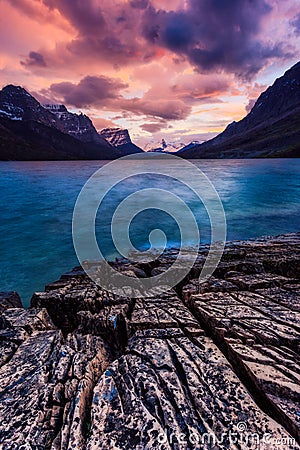 Sunset on the shore of St Mary Lake in Glacier National Park, Mo Stock Photo