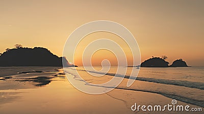 Sunset silhouette of mountains islands at sea bay. Seascape at sand beach. Nobody nature landscape Stock Photo