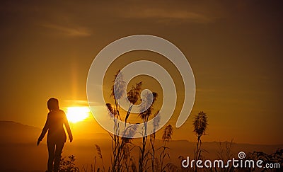 Sunset silhouette Young woman alone Stock Photo