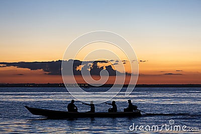 Sunset and silhouettes on boat cruising the Amazon River, Brazil Stock Photo