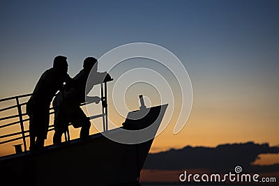 Sunset and silhouettes on boat cruising the Amazon River, Brazil Stock Photo