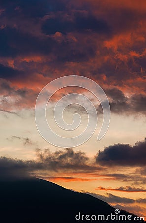 Sunset sky with mountain background Stock Photo