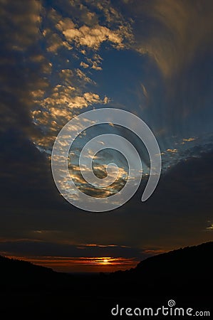 Sunset sky with punch hole clouds Stock Photo