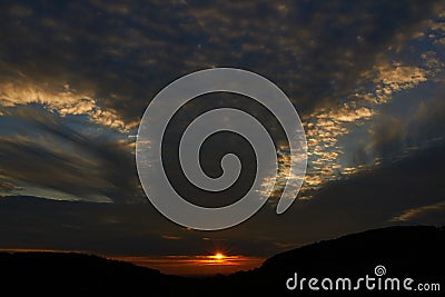 Sunset sky with punch hole clouds Stock Photo