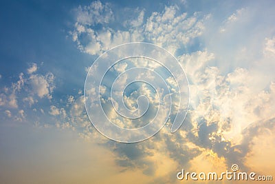 sunset sky with rays of light shining down pass clouds and sky Stock Photo