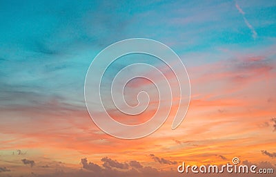 Sunset sky in red and blue color with subtle clouds Stock Photo