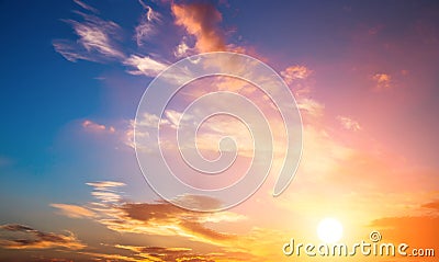 Sunset sky and sun. Dramatic sunset sky with orange colored clouds and sun. Stock Photo