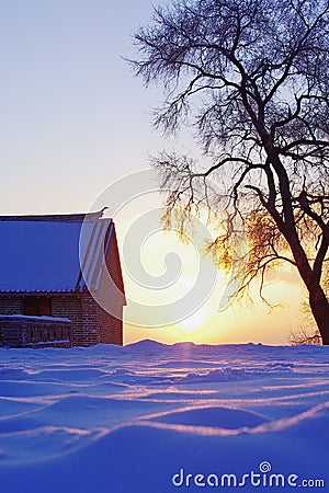 Sunset on snow field Stock Photo