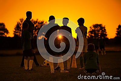 Sunset Soccer. Kids Soccer Football Team on Training with the Coach Editorial Stock Photo