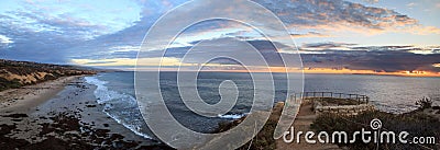 Sunset in a stone overlook that views Crystal Cove State Park Be Stock Photo