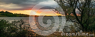 Scenic panorama view of a sunset over Sweet Briar Lake, North Dakota. Stock Photo