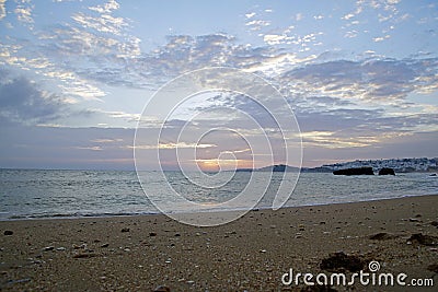 Sunset sun over the ocean. Bright colors of the evening sky. Stock Photo
