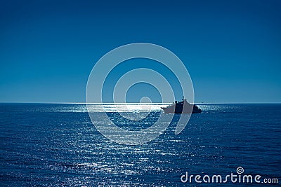 Sunset sunrise boat reaching Ibiza port Stock Photo