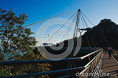 Sunset time on bridge. Modern construction. Connection concept. Cable car Stock Photo