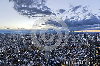 Sunset of Tokyo Skyline and Lights in Windows Stock Photo