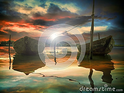 The sunset and two fishing boats Stock Photo