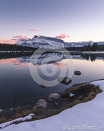 Sunset at Two Jack Lake with the first snow of the year Stock Photo