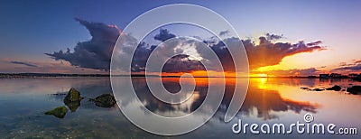 Sunset under storm clouds on the Dorset Coast Stock Photo