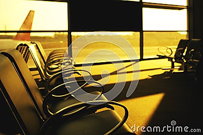Sunset view from airport lobby with a benches Stock Photo