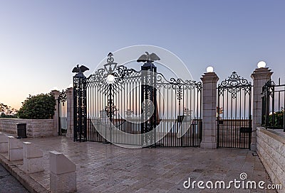 Sunset view of decorative gate at the entrance to the upper terrace of the Bahai Garden in Haifa city in Israel Editorial Stock Photo