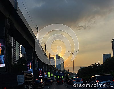 sunset view on the highway with lots of cars in the middle of jakarta traffic Editorial Stock Photo