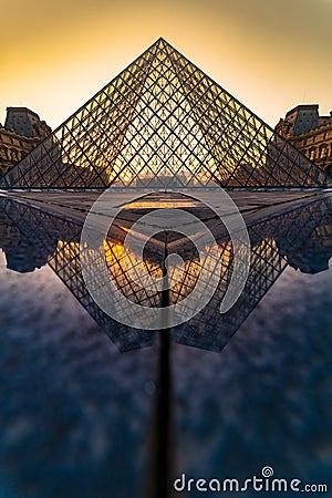 Sunset view of the Louvre museum reflection Editorial Stock Photo