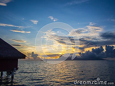 Sunset View of Moorea Island from Intercontinental Resort and Spa Hotel in Papeete, Tahiti, French Polynesia Stock Photo