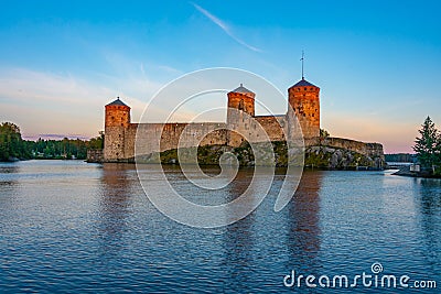 Sunset view of Olavinlinna castle in Savonlinna, Finland Editorial Stock Photo