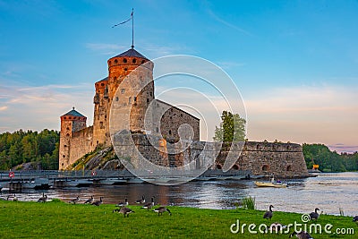 Sunset view of Olavinlinna castle in Savonlinna, Finland Editorial Stock Photo