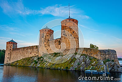 Sunset view of Olavinlinna castle in Savonlinna, Finland Editorial Stock Photo