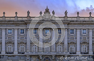 Sunset view of the ornate baroque architecture of the Royal Palace viewed from Plaza de Oriente in Madrid, Spain Stock Photo