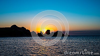 sunset view to the sea with coastline. Sardinia, Italy Stock Photo