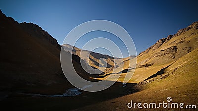 Sunset view to Tash-Rabat river and valley in Naryn province, Kyrgyzstan Stock Photo