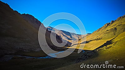 Sunset view to Tash-Rabat river and valley in Naryn province, Kyrgyzstan Stock Photo