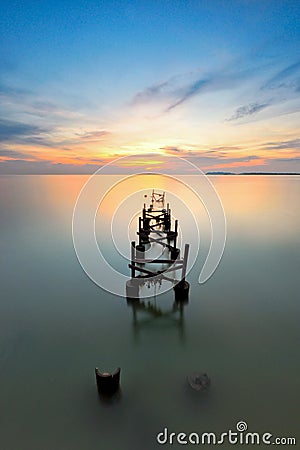 Sunset views over abandoned jetty Stock Photo