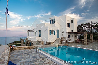 Sunset vila and pool view during hot summer day on Antiparos island in Cyclades in Greece Stock Photo