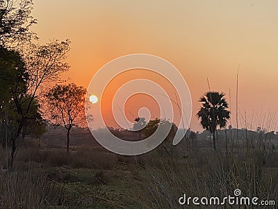 Sunset at village site Stock Photo