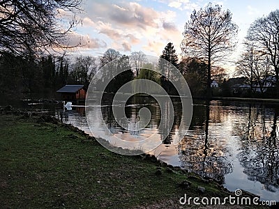 Sunset walk around a lake Stock Photo