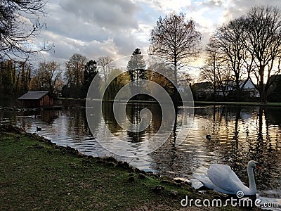 Sunset walk around a lake Stock Photo