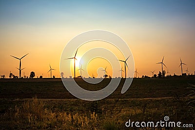 Sunset at wind turbine farm Stock Photo