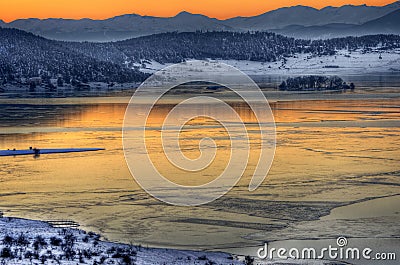 Sunset winter picture with lake Stock Photo