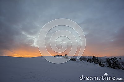 Sunset In The WinterIn The Mountains. Winter Evening. Snow. Stock Photo