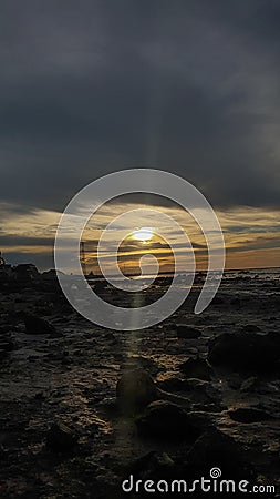 the sunsets when the sea recedes Stock Photo