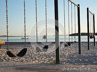 Sunsets, Swings and Sailboats Stock Photo