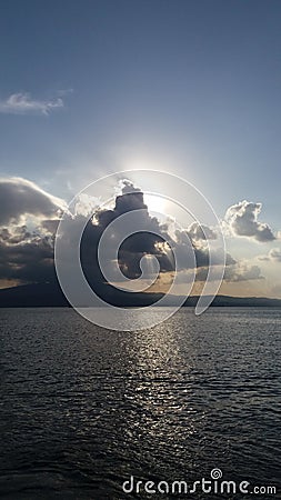 sunshine behind the clouds Stock Photo