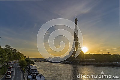 Sunshine Over Paris at Sunrise With Eiffel Tower Seine River and Traffic Stock Photo