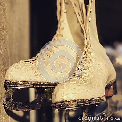 A pair of old ice skates hang outside of a cafe in Ukraine Stock Photo