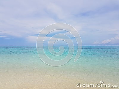 Sunshine on a sea wave at Karon beach, Phuket, Thailand. Sunny summer sea beach waves. Sunshine sea wave near sandy beach. Stock Photo