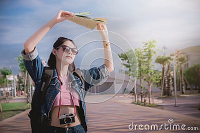 Sunshine in the summer and women traveler hold a map to protect Stock Photo