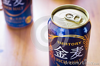 Suntory Japanese beer rich malt in a blue can. Editorial Stock Photo